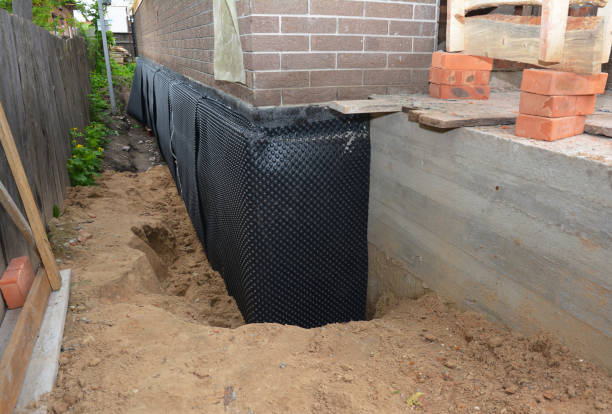 SJ Waterproofing Pros technician performing targeted Basement Waterproofing assessment in Dalton, PA